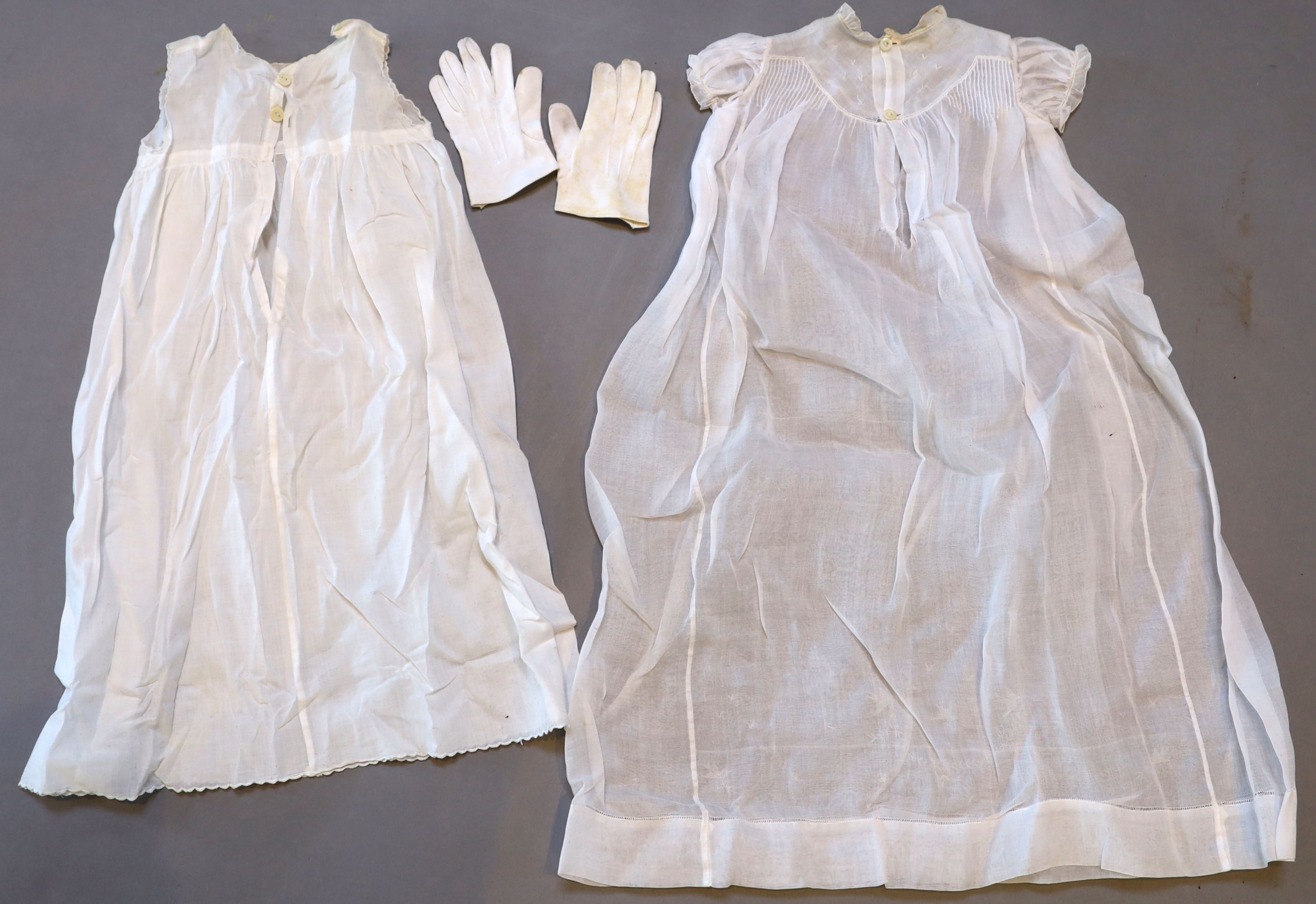 A collection of embroidered whitework christening robes